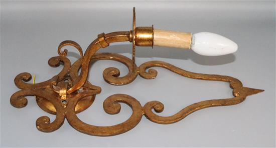A set of 7 gilt wrought iron wall lights(-)